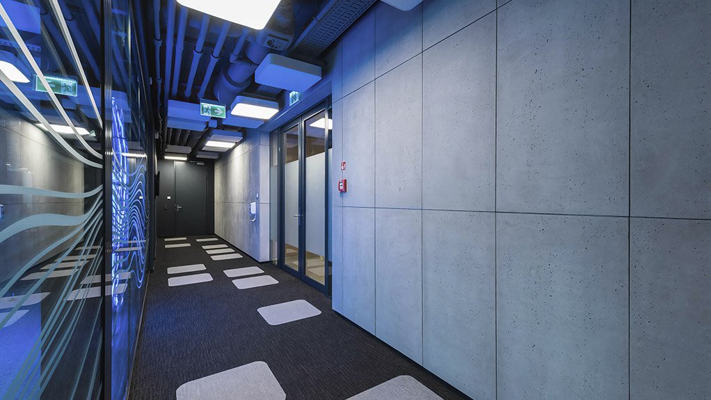 In this technology company’s commercial office, concrete provides a strong visual focal point. Natural pitting and subtle variations in tone give the panels an authentic mineral quality, adding texture and contrast to the otherwise precise, engineered interior