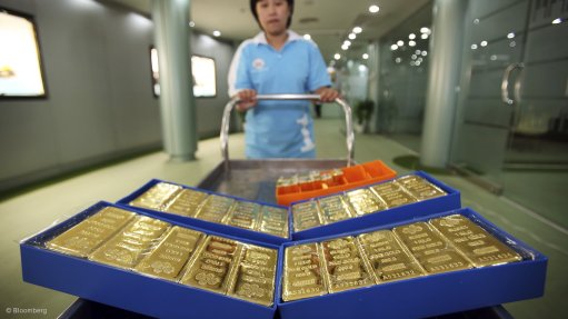 Gold on trolley being pushed