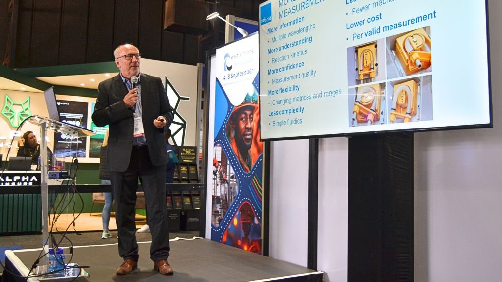 Rainer on stage giving a presentation