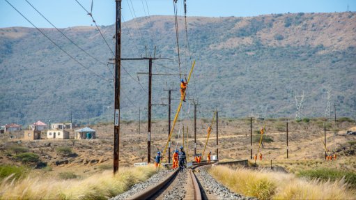 The above image depicts Transnet technicians restoring train control systems