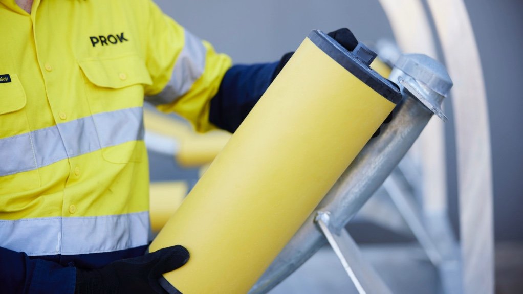 An image of a PROK employee assembling an idler frame