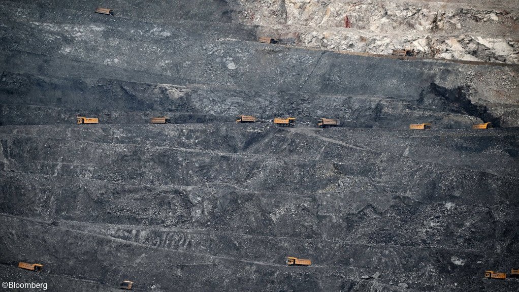 Trucks transporting ore in a copper mine