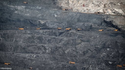 Trucks transporting ore in a copper mine