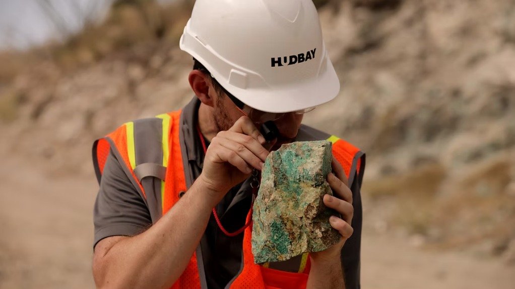 Hudbay employee with copper ore