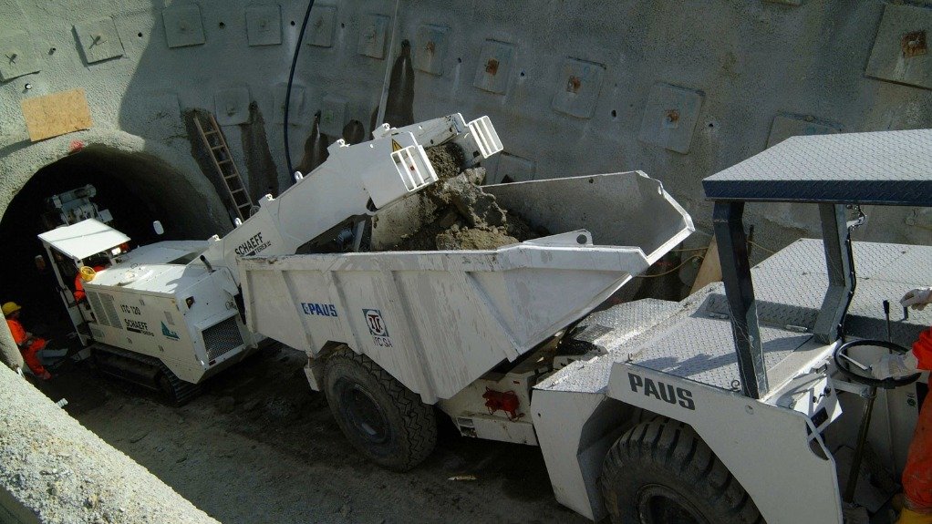 An image of a continuous loading machine paired with a bi-directional haul truck