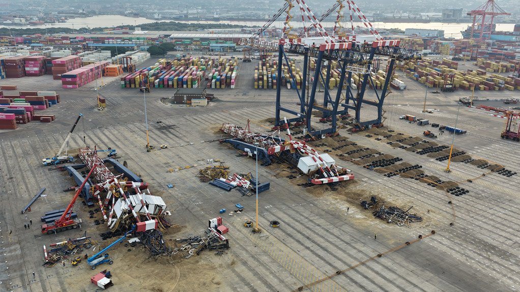 With two cranes down, crews began cutting the steel into transportable sections at ground level while the remaining two cranes stood over their prepared landing beds.