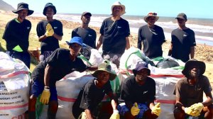 Image of TLP staff and volunteers in Bata gumboots cleaning the KZN beaches following the floods