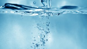 An image of water being poured in a glass