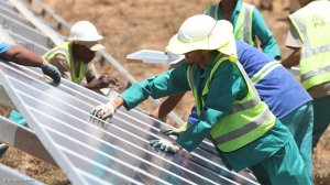 Workers installing solar panels