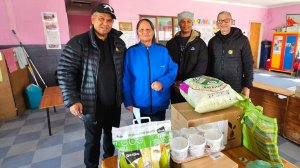 Image of AJF handing over educare boxes and food to Principal Matild of Pelikaan Bewaarskool ECD in Veldrift