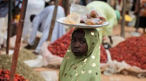 A child selling food items in Nigeria