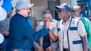 Barrick’s Mark Bristow greets Tanzania Minerals Minister Anthony Mavunde at African training academy, which is augmenting the closing Buzwagi mine’s transformation into a 3 000-job-a-year special economic zone with airport terminal.