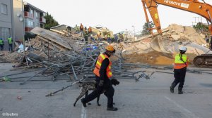 Rescuers search for survivors after South Africa building collapses