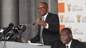 Trade, Industry and Competition Minister Parks Tau speaks while International Relations Minister Ronald Lamola listens during a joint briefing in Germiston