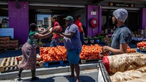 People buying vegetables at a market